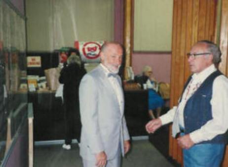 Pastor Paul S Arnopoulos dressed for the Senior's Day Fashion Show waiting with volunteer models in the dressing room.